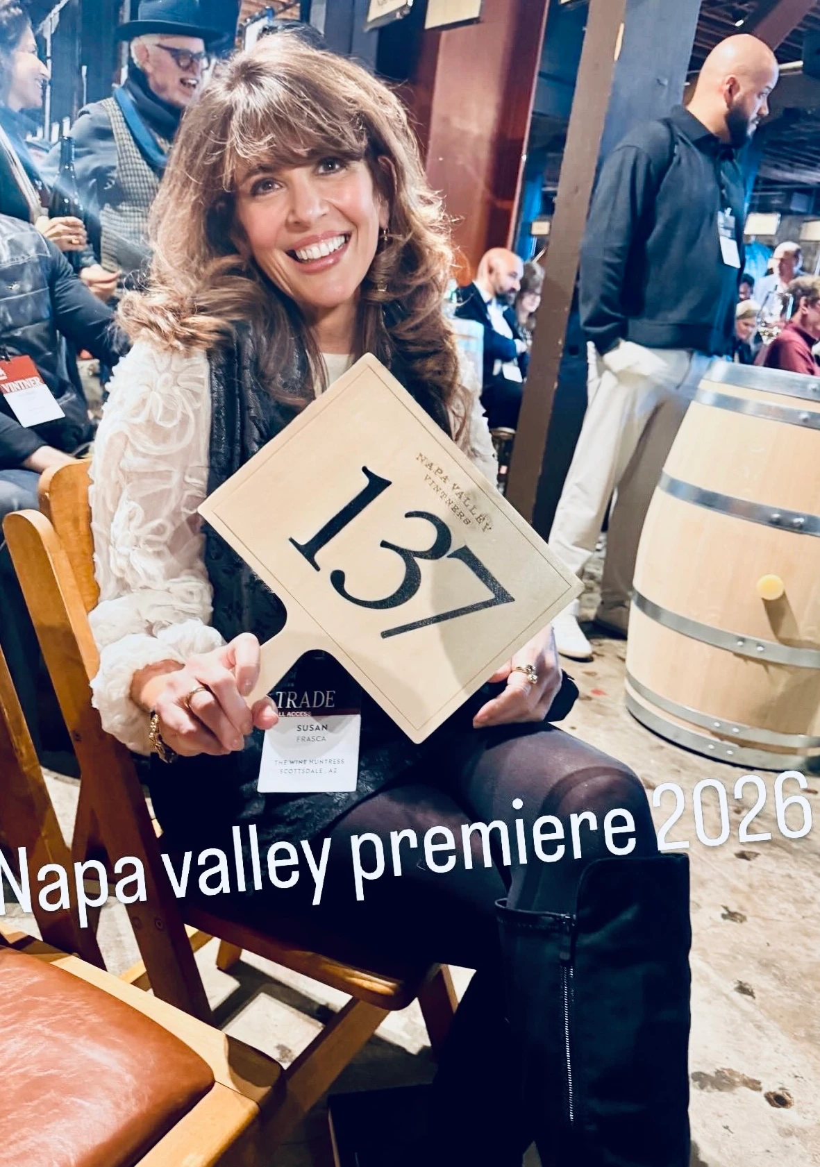 Susan at Napa Valley Premiere 2026 holding the event sign