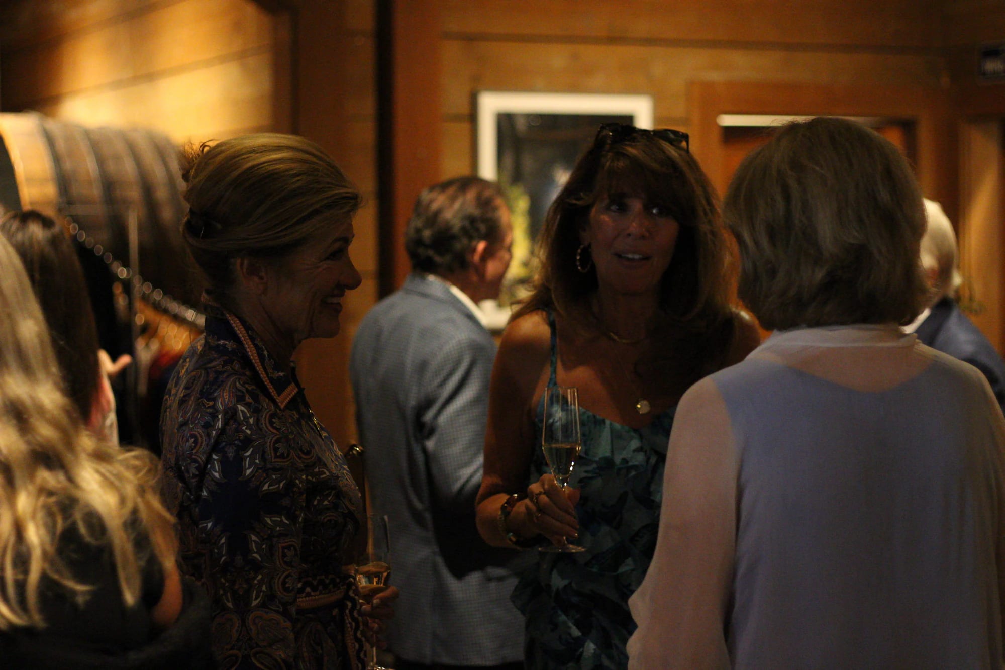 Guests talking over a glass before dinner